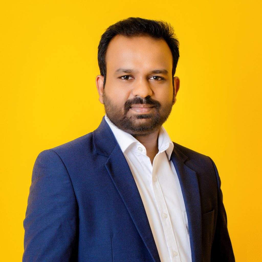 Photo of a man in a suit representing the Radio Society of Sri Lanka, highlighting professionalism and international recognition.