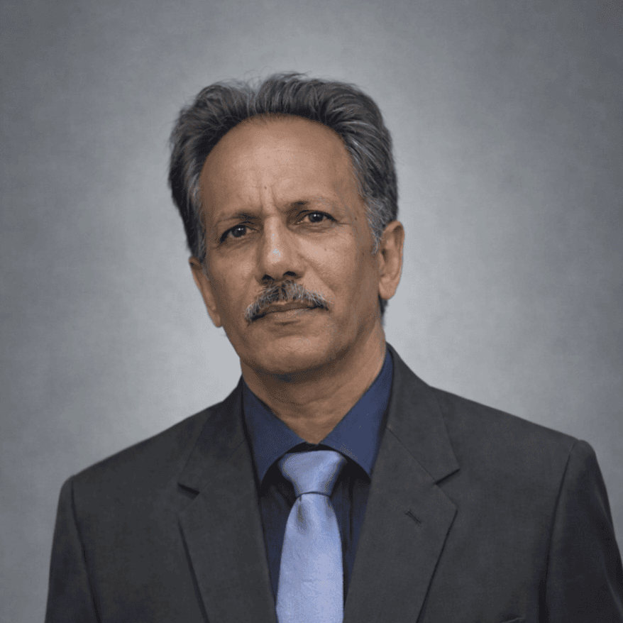 Senior male amateur radio operator in formal attire.