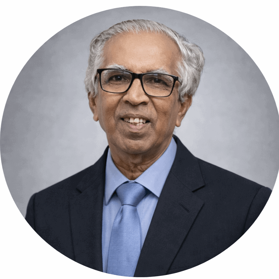 A distinguished Sri Lankan amateur radio expert with glasses and grey hair.